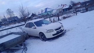 Седан Mazda Familia 1999 года, 170000 рублей, Берёзовский